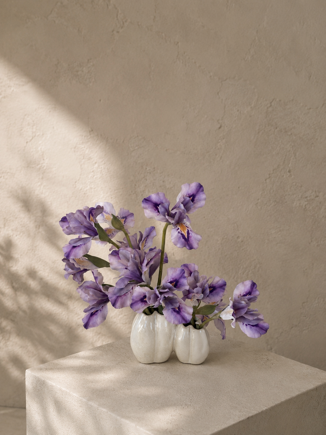 PO010 sculptural iris arrangement in a double ceramic vessel